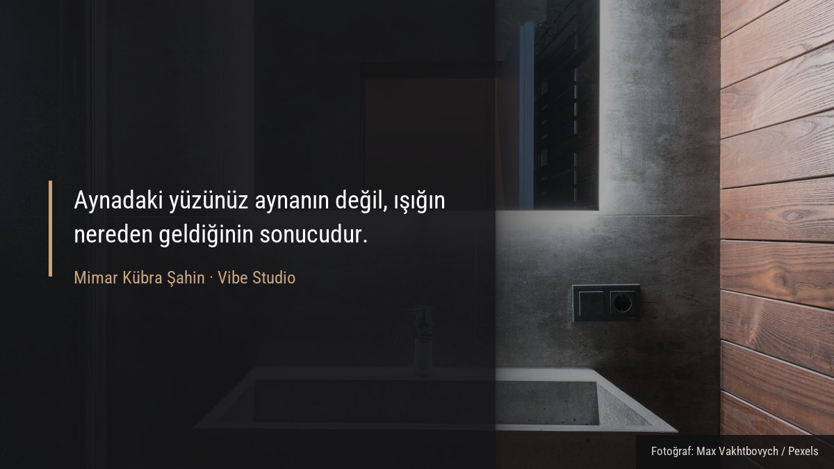 Işıklandırmalı ayna ve beton lavabolu modern banyoda aydınlatma detayı